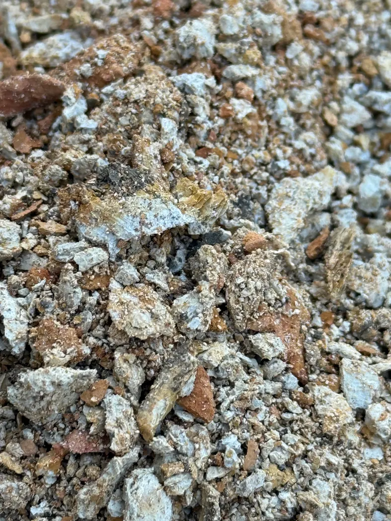 Close-up of excavated soil and rock fragments