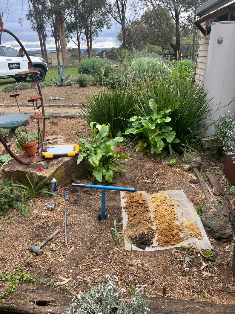 Hand-auger investigation and soil samples beside an established residential garden
