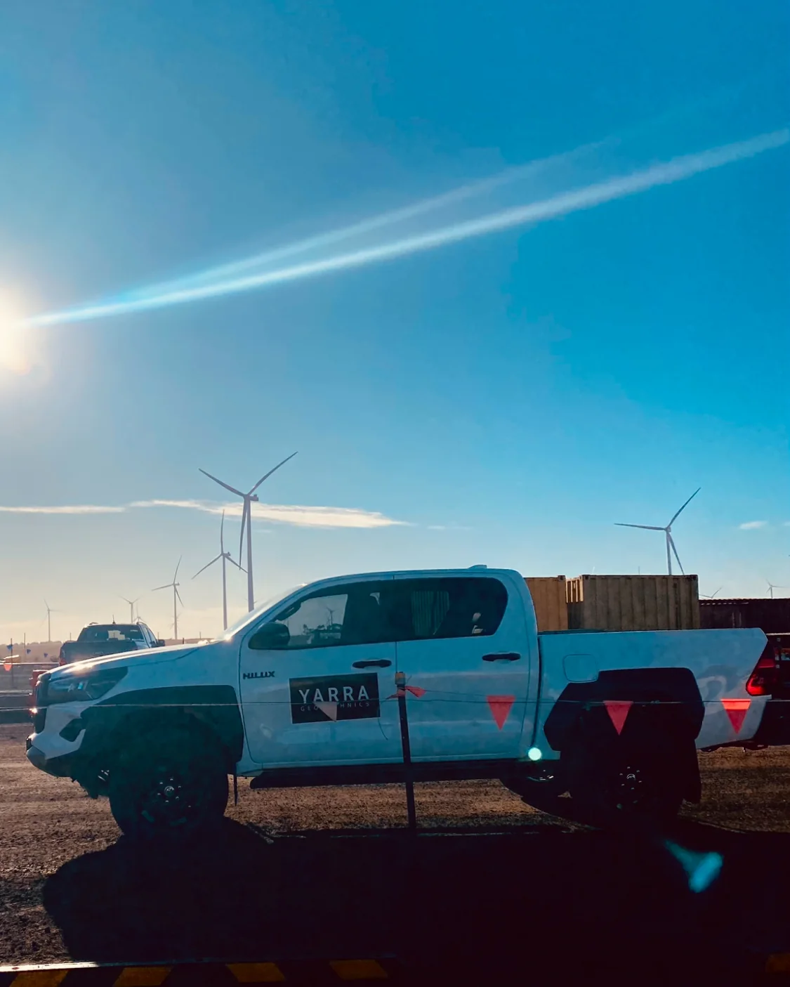 Yarra Geotechnics field vehicle with wind turbines in the background at Golden Plains.