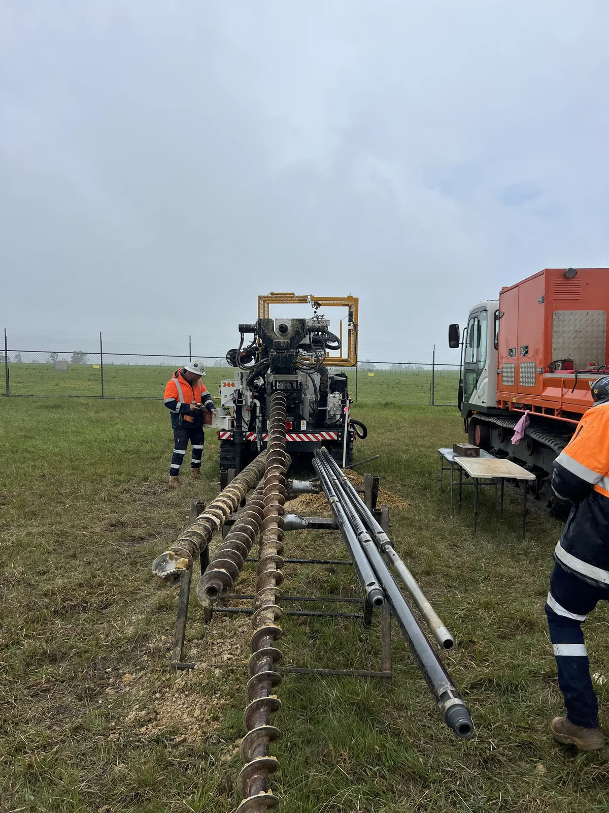 Drilling rig, augers and rods with field crew at the Hazelwood investigation site.