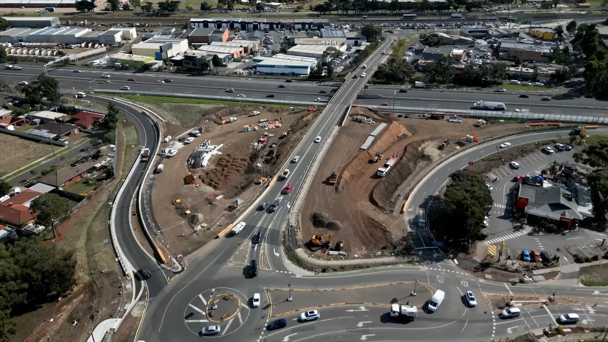 Aerial view of the Point Cook road bridge with surrounding earthworks and traffic lanes.