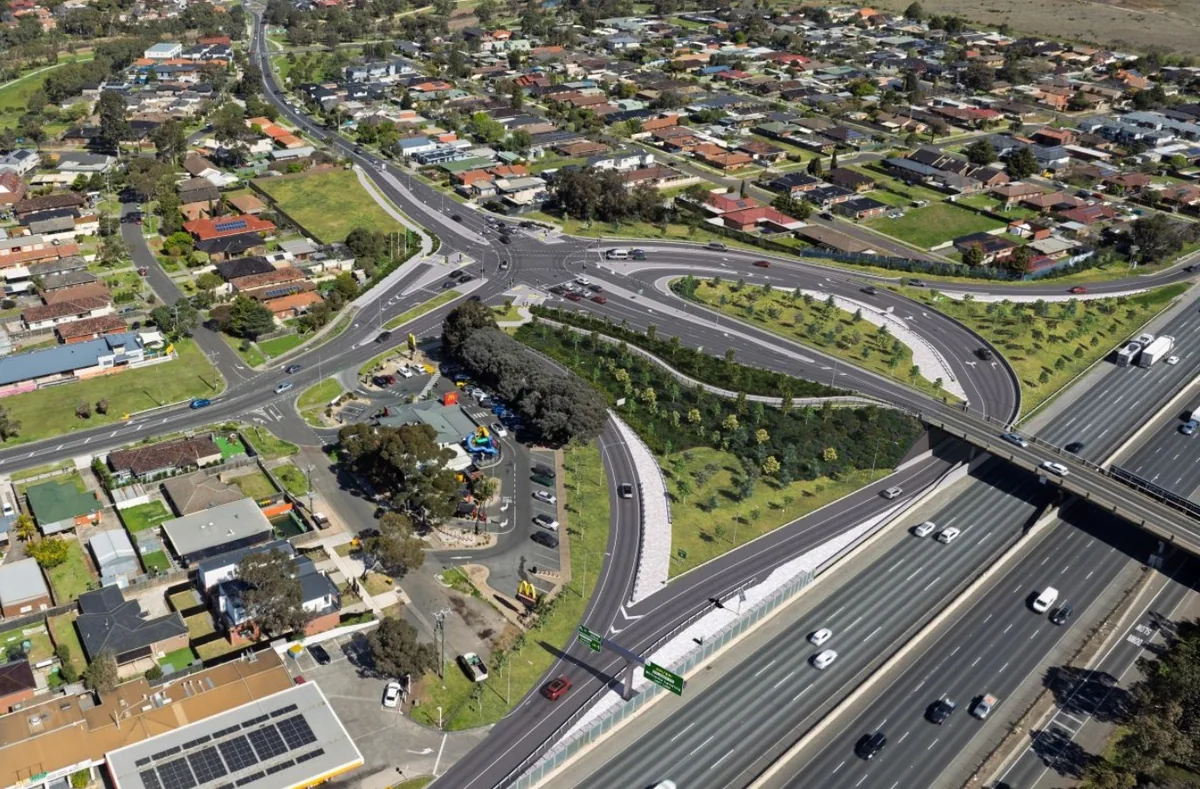 Aerial overview of the Point Cook Road intersection and freeway connections, with surrounding residential streets.